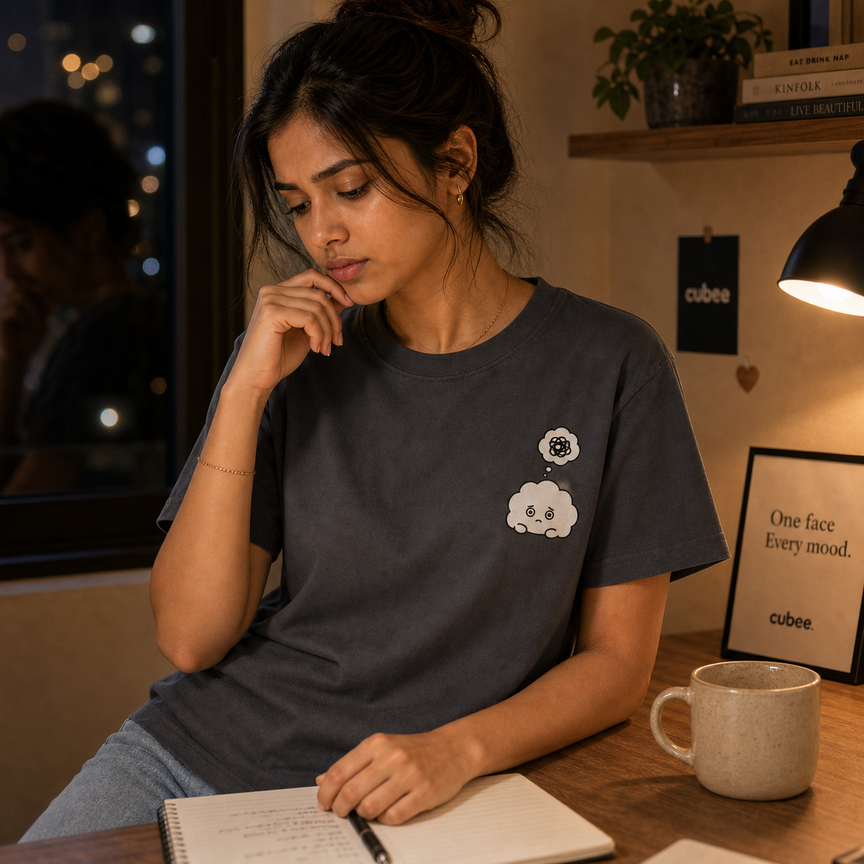 Model wearing a dark Cubee moodwear tee
